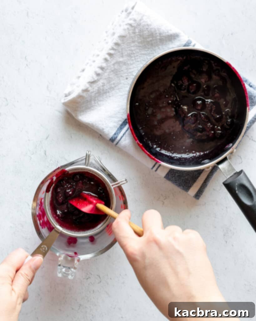 Raw ingredients for blueberry ganache: white chocolate chunks, blueberries, and heavy cream.