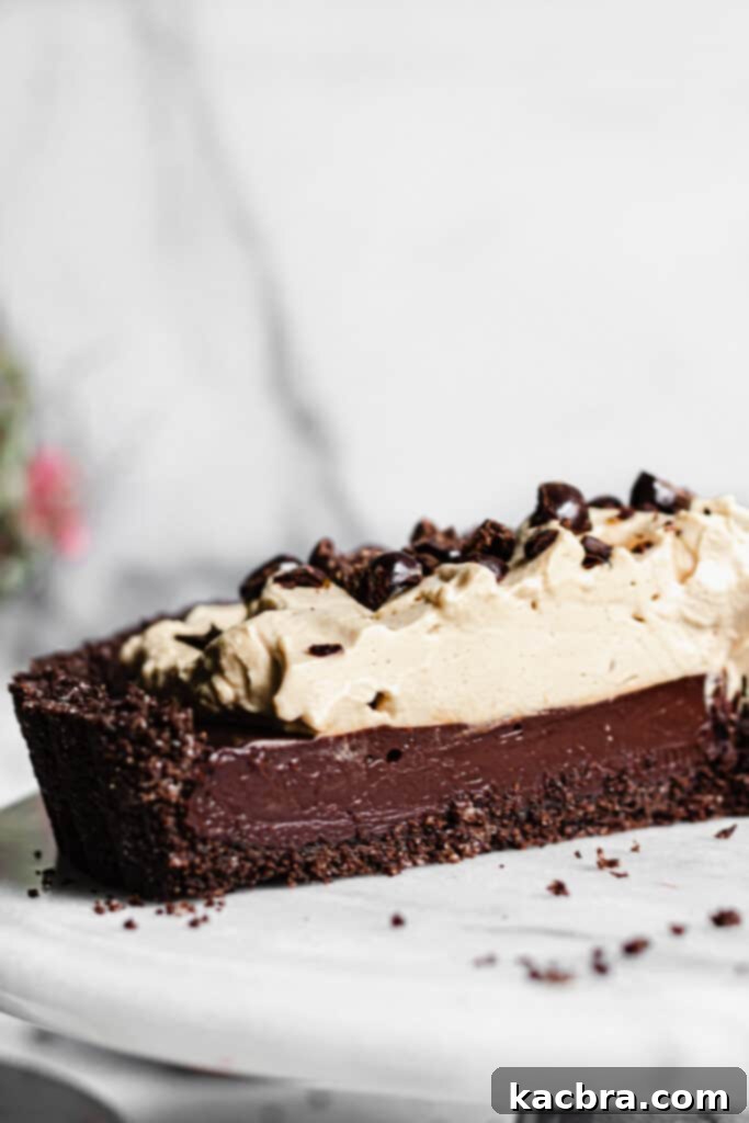 A close-up of the Chocolate Espresso Tart with a generous layer of espresso whipped cream.