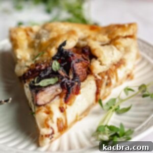 Sweet Caramelized Onion & Mushroom Potato Tart 13 Slice of potato tart on a plate.