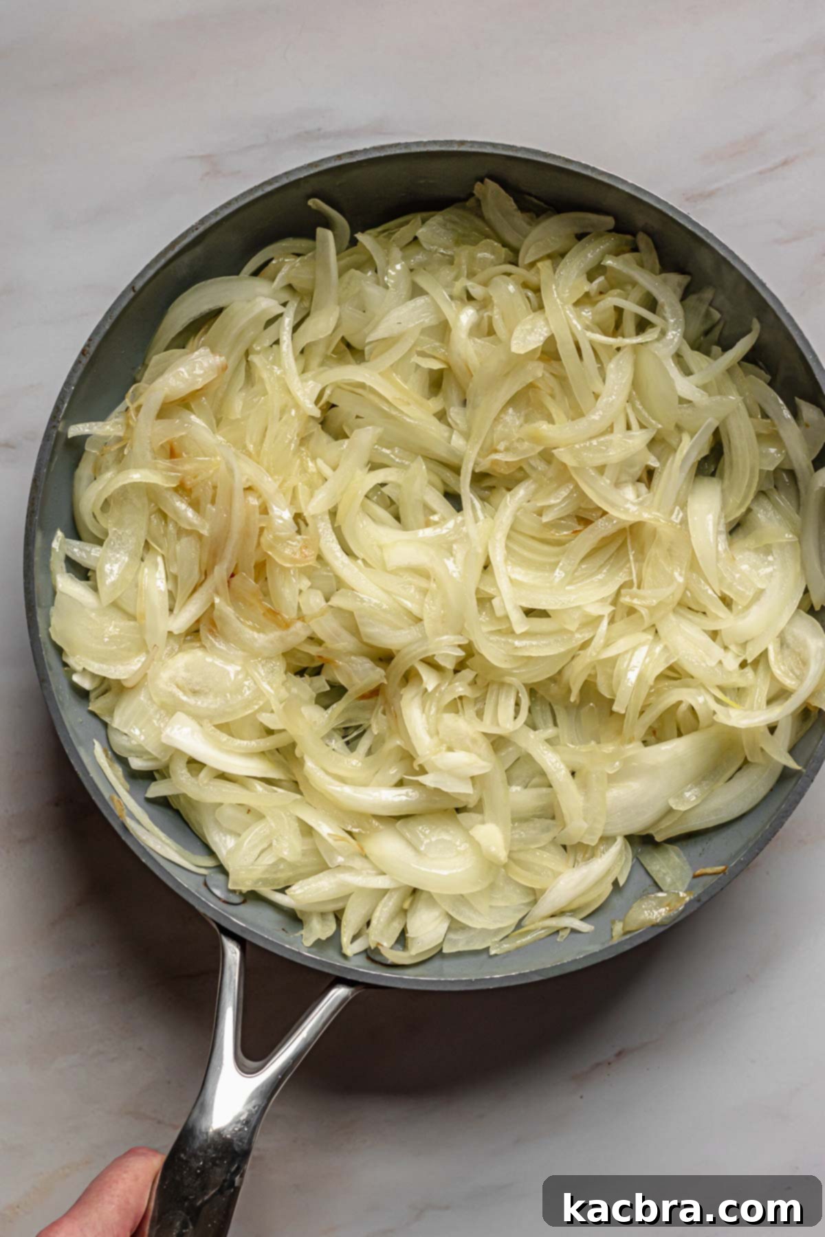 Sweet Caramelized Onion & Mushroom Potato Tart 4 Sliced onions in a pan ready to be caramelized.