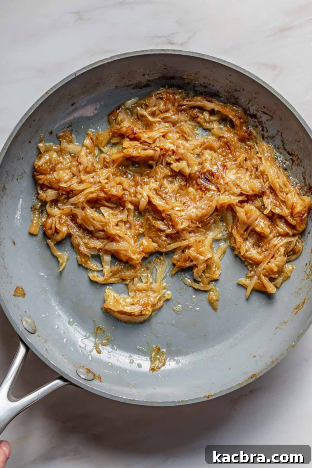 Sweet Caramelized Onion & Mushroom Potato Tart 5 Caramelized onions in a pan.