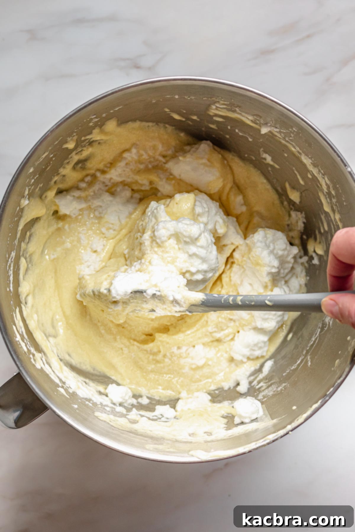 Folding in all egg whites.