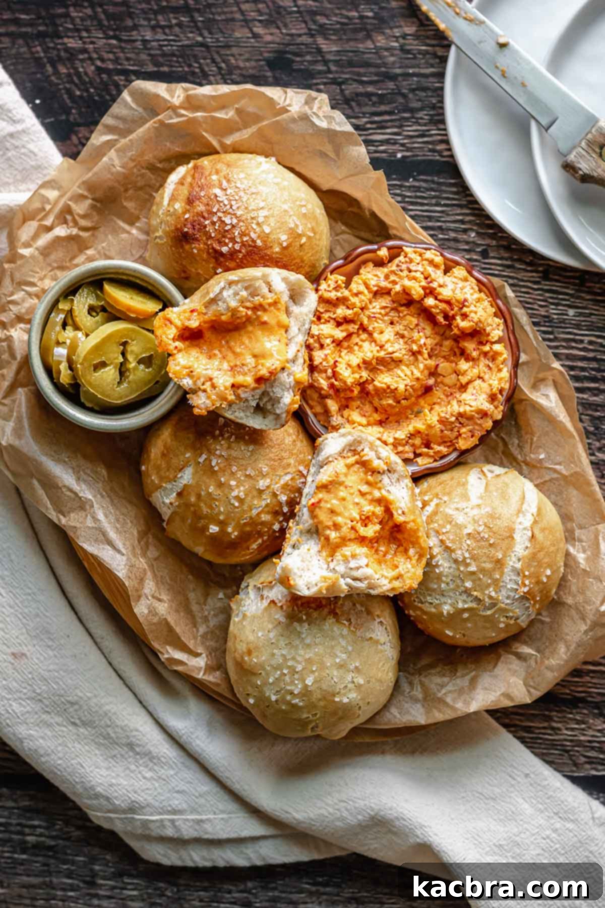 Savory Pimento Pretzel Twists 2 Platter of pimento cheese stuffed pretzels, golden brown and sprinkled with salt, ready to be served.