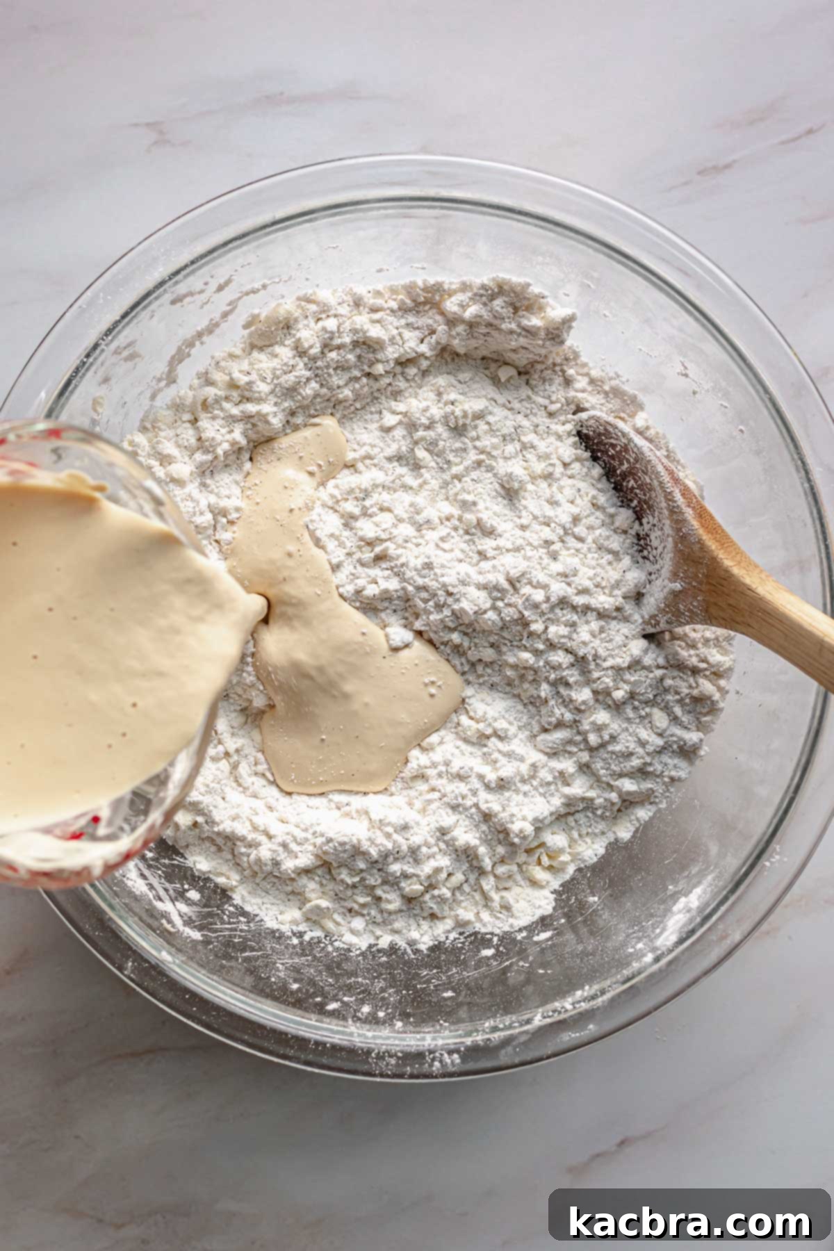 Bergamot Scones with Tangy Lemon Glaze 6 Wet ingredients pouring into the dry ingredients.