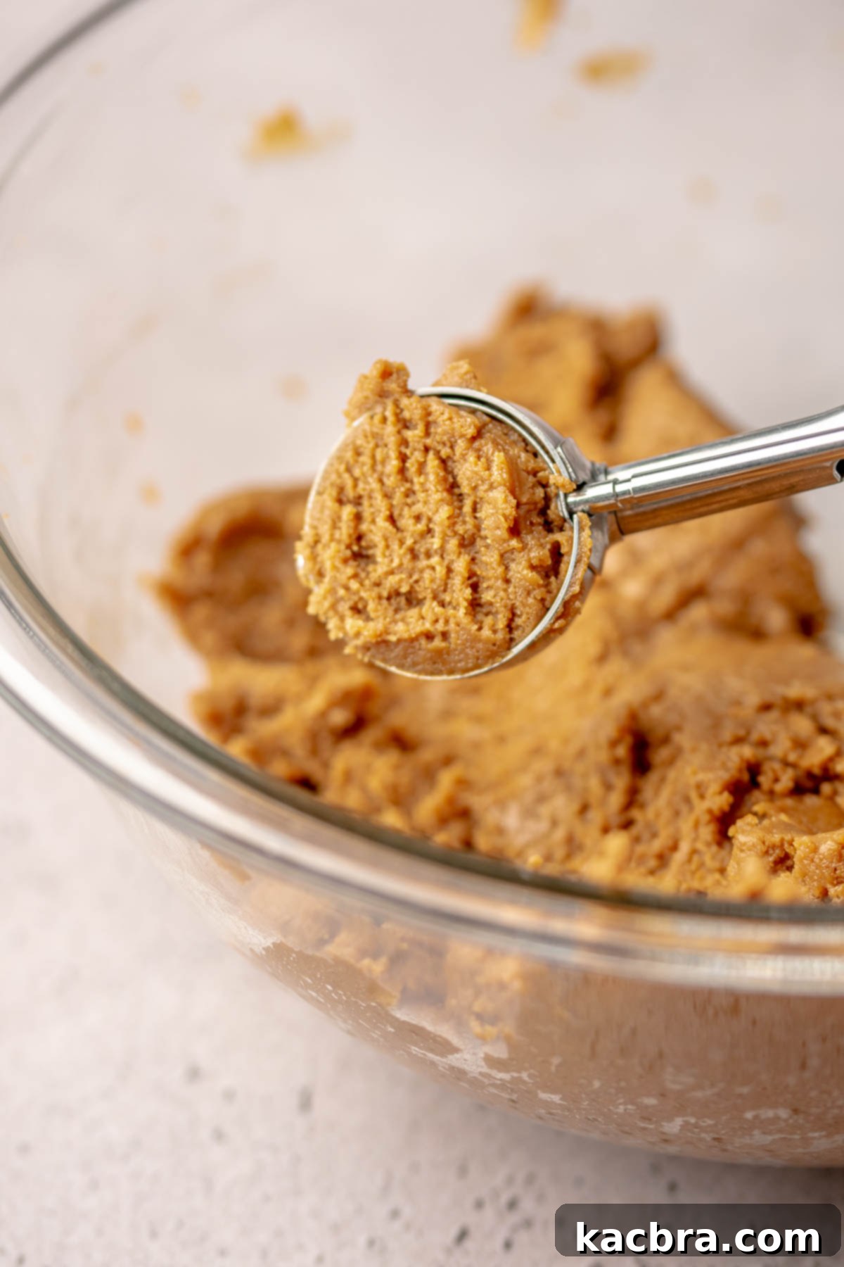 Irresistible Biscoff Cookie Truffles 7 A cookie scoop filled with Biscoff truffle mixture, ready for shaping.