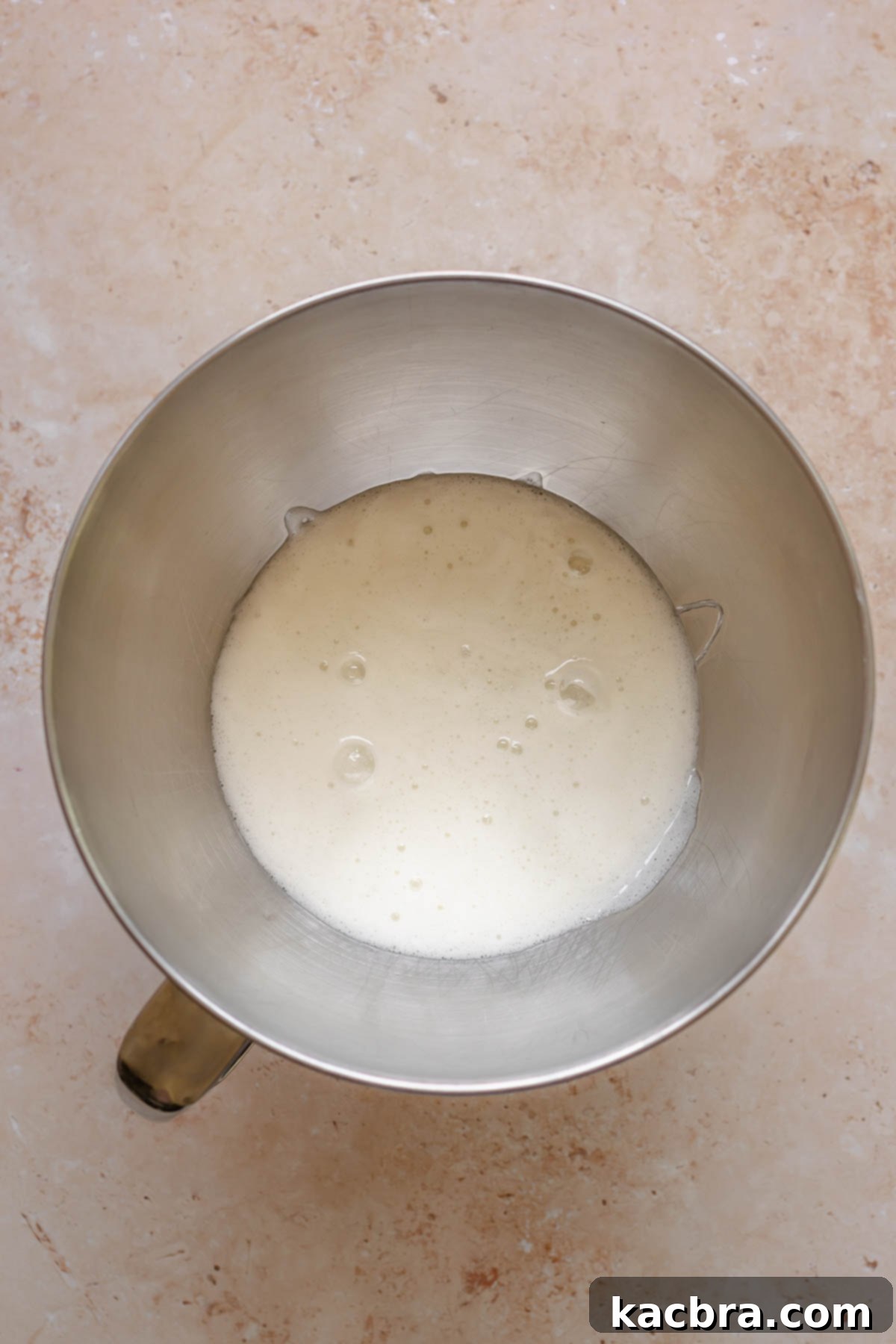 Heated meringue pre-whisked in a bowl.