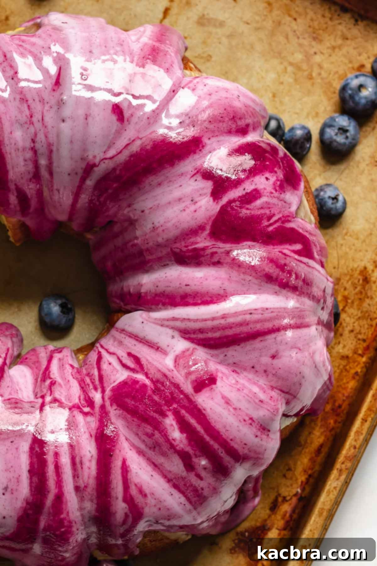 Marbled blueberry glaze on a Bundt Cake.