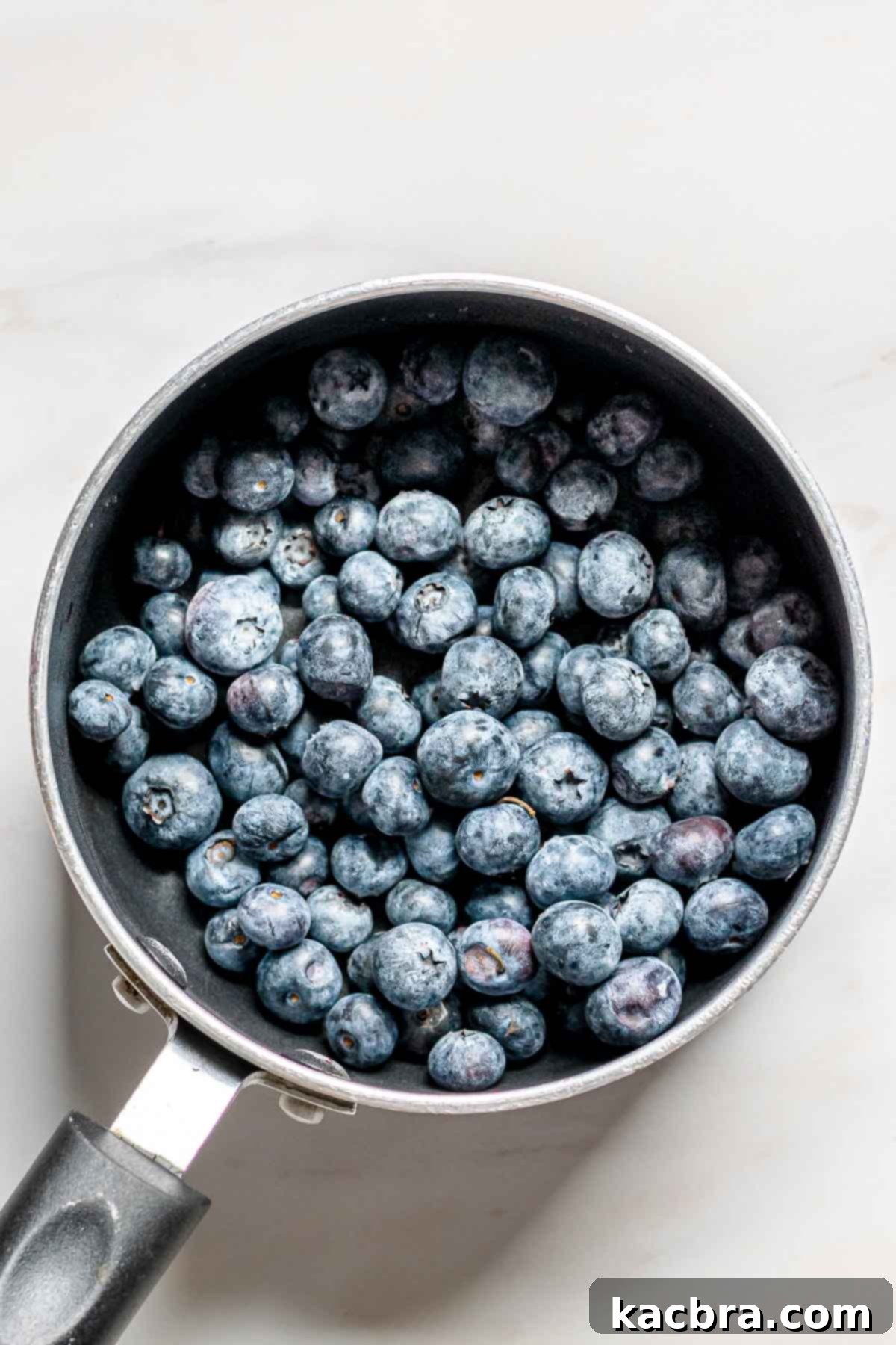 Blueberries in a small saucepan.