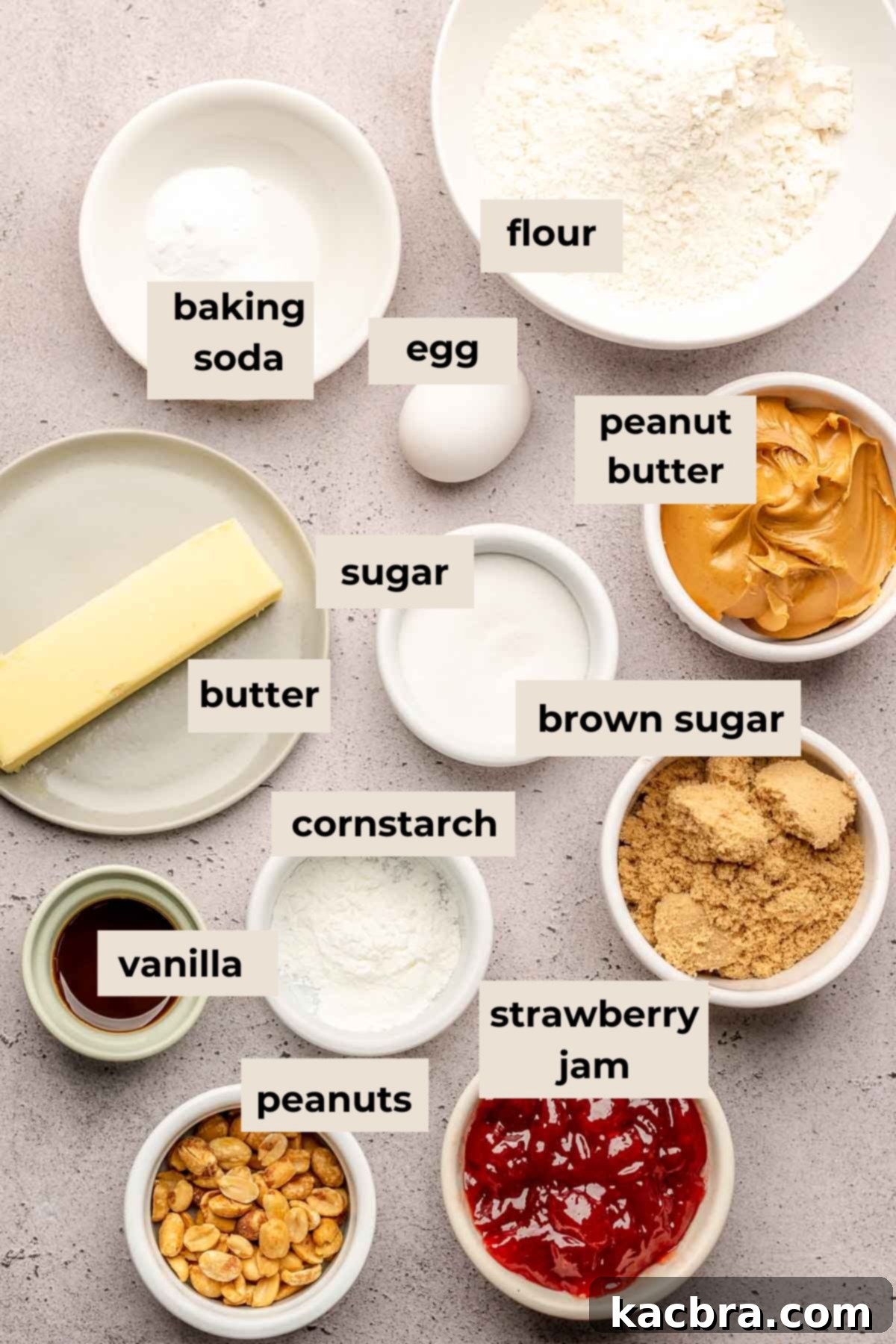 Jammy Peanut Butter Delights 3 Ingredients for peanut butter jelly cookies laid out on a table.