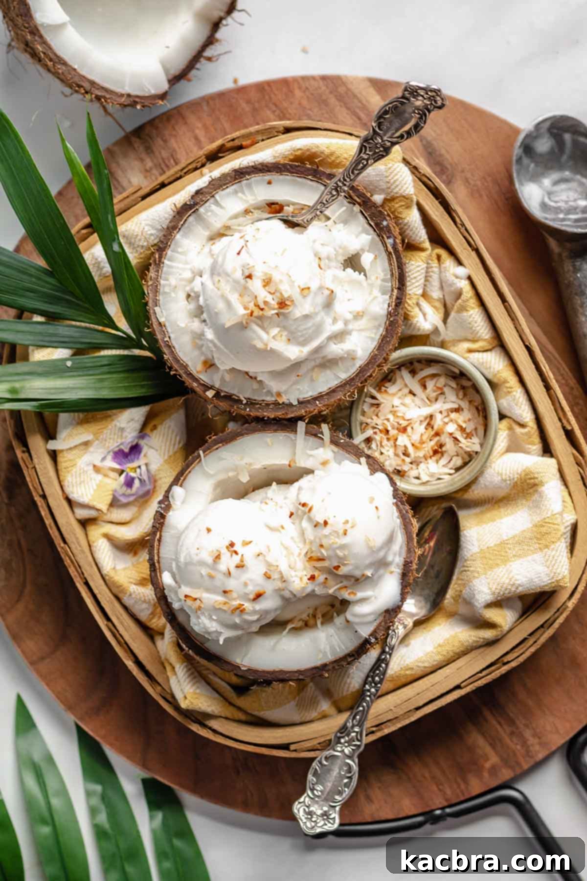 Two vibrant coconut shells overflowing with freshly scooped coconut sorbet, nestled in a rustic basket, evoking a perfect summer scene.