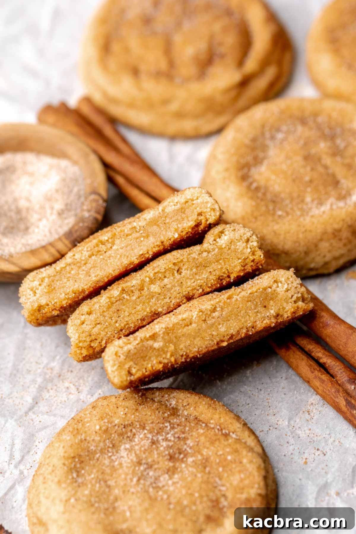 Brown butter snickerdoodle cookies cut open and laying next to each toher.