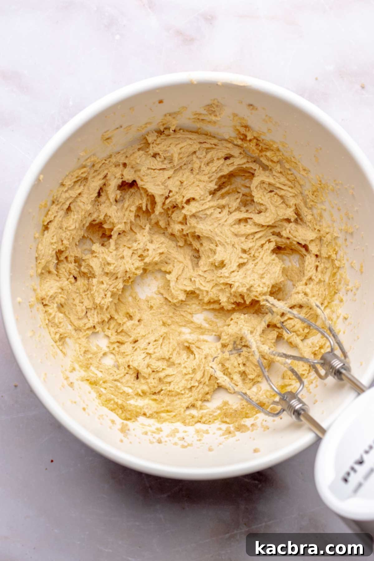 Creamed cookie dough ingredients in a bowl.