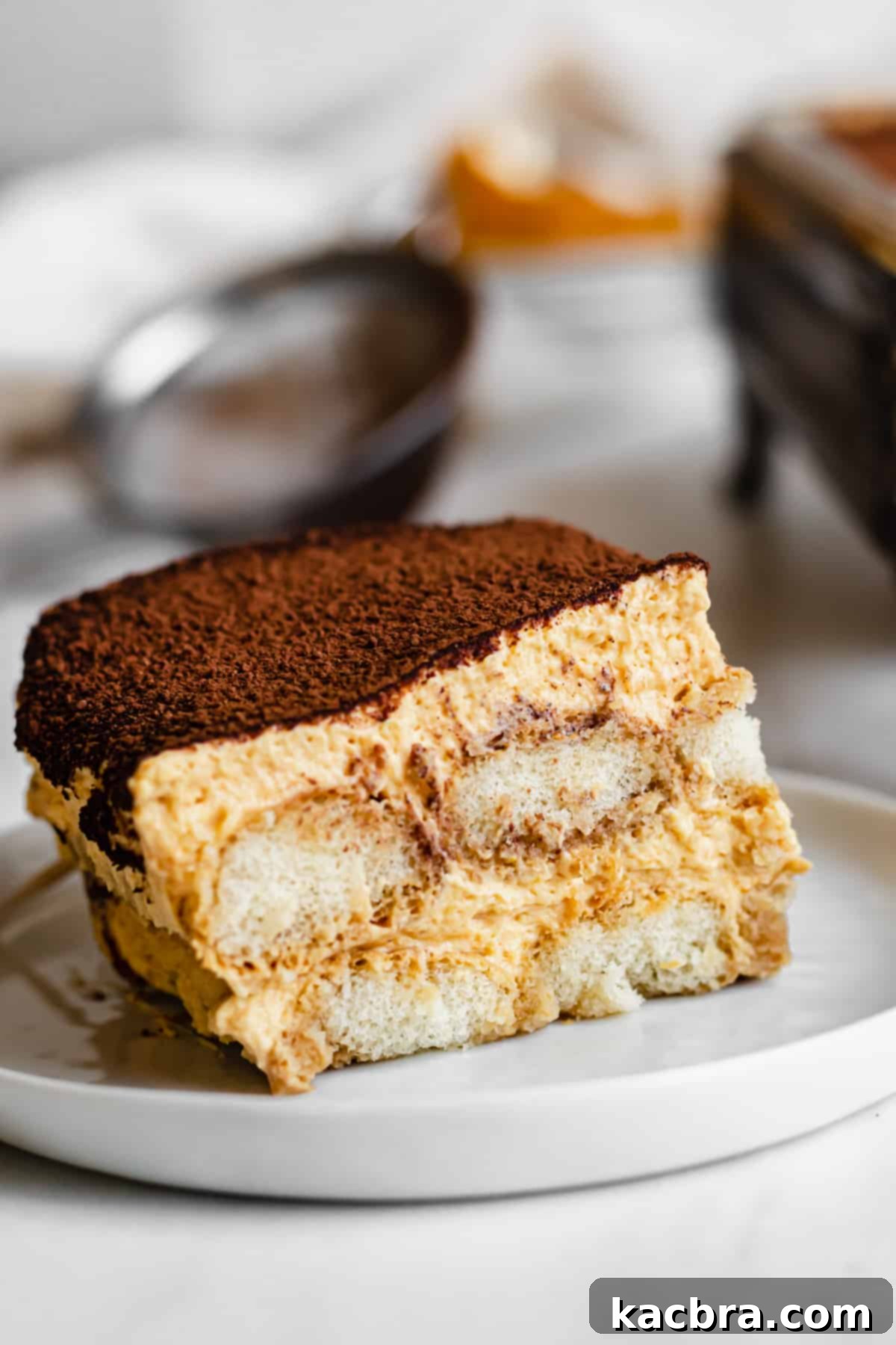 Harvest Pumpkin Chai Tiramisu 2 One slice of pumpkin chai tiramisu on a plate