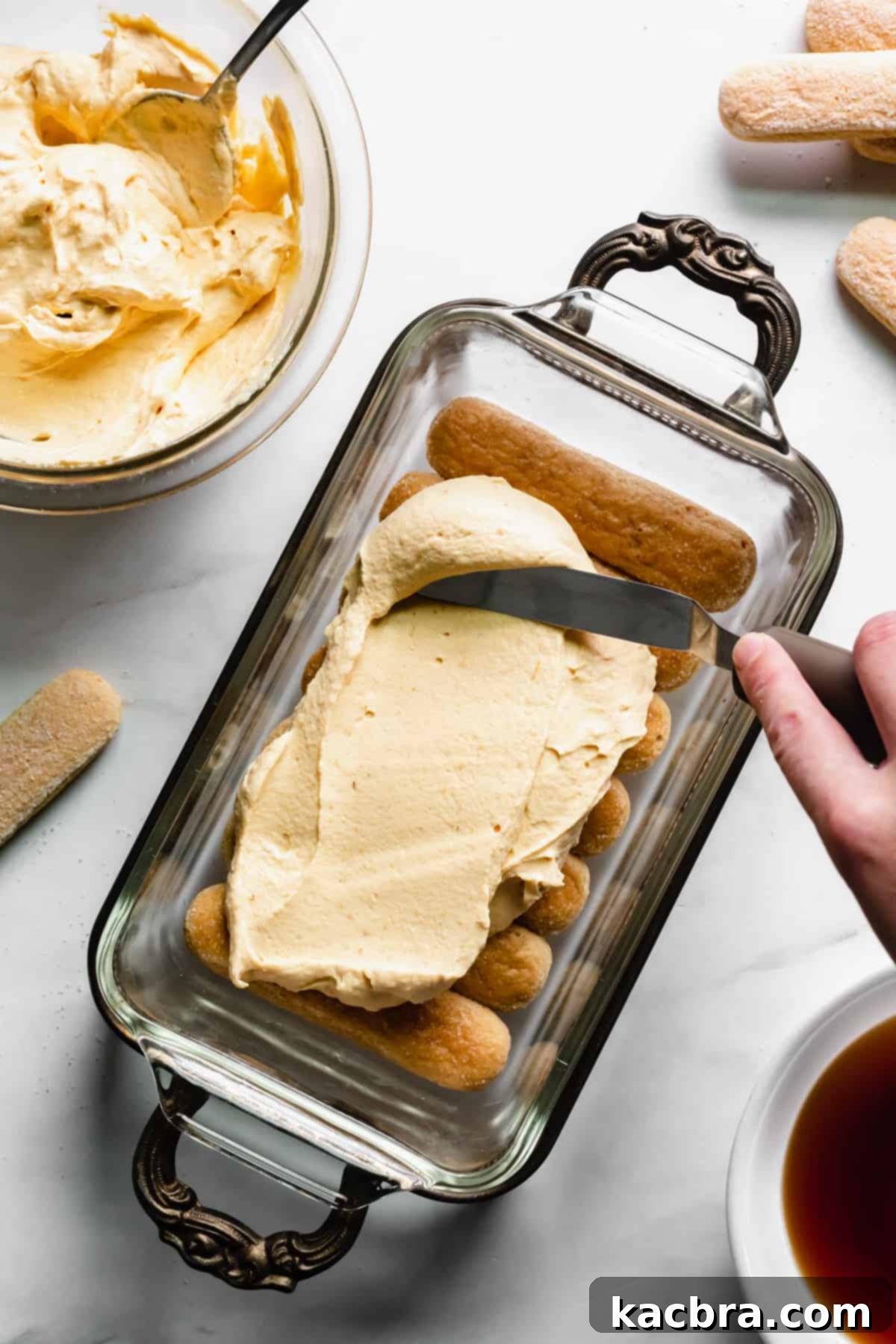 Harvest Pumpkin Chai Tiramisu 6 Pumpkin mascarpone mixture spread onto the first layer of lady fingers.