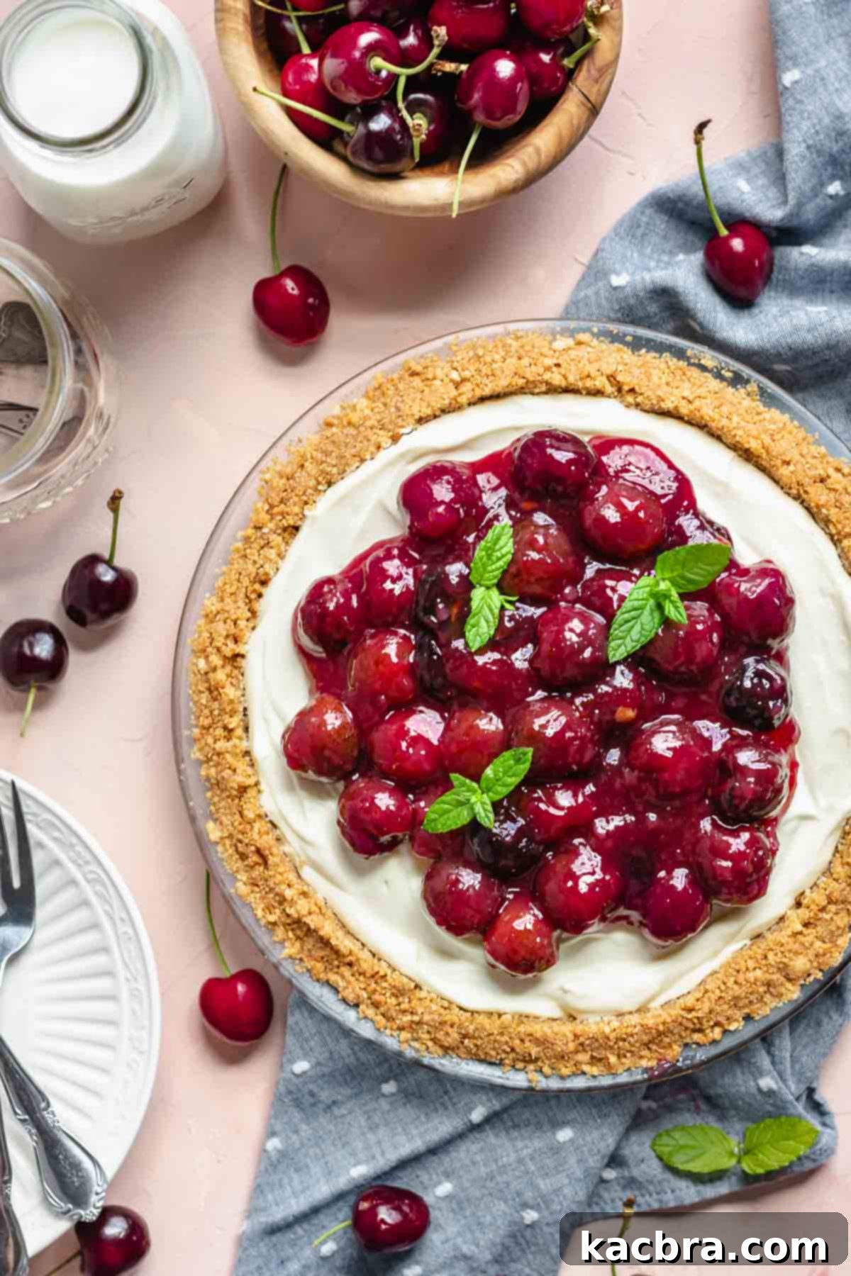 Finished cherry cheesecake pie, showcasing its layers and rich cherry topping.