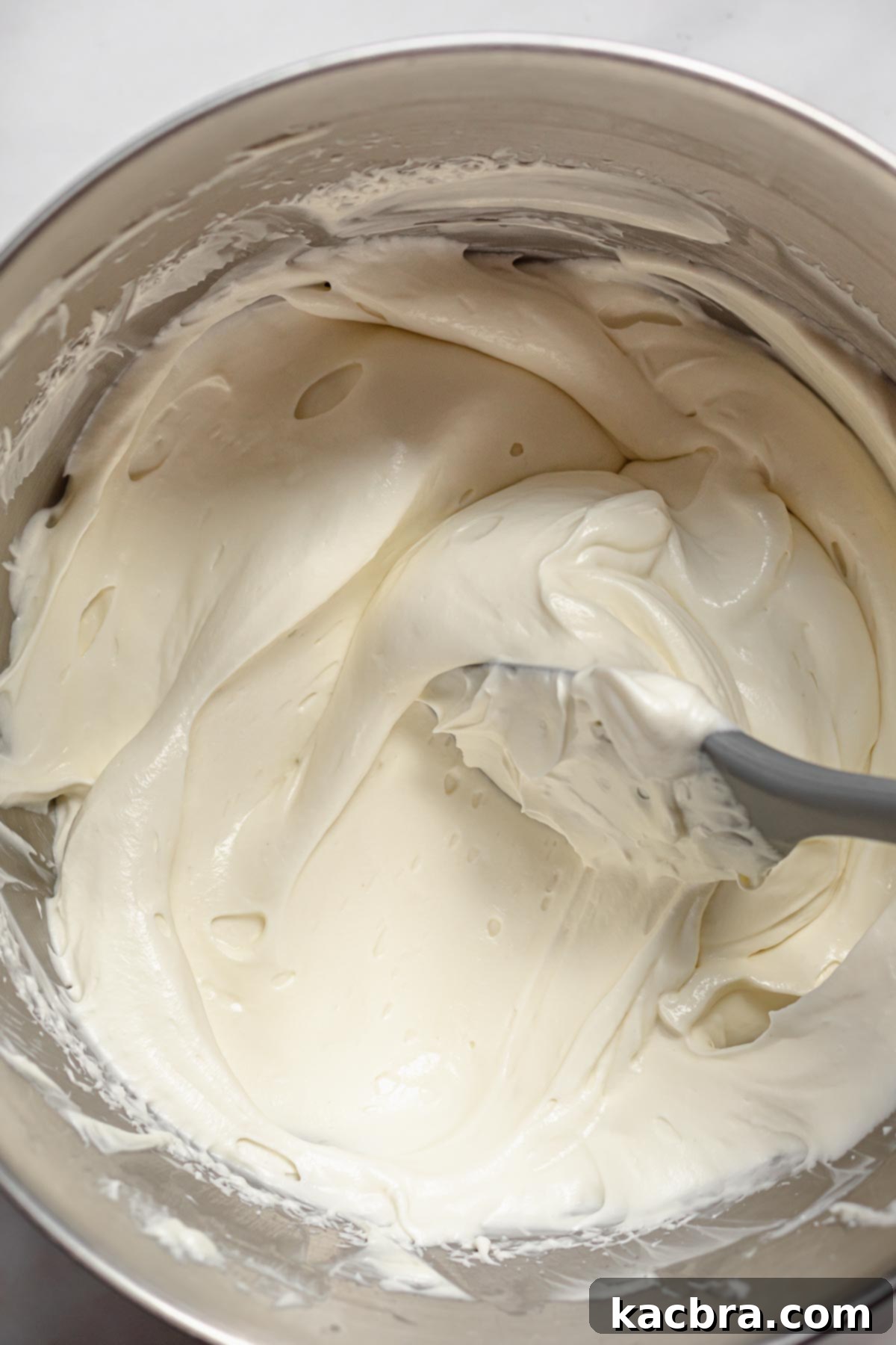 Fluffy and airy cheesecake mixture after heavy whipping cream has been incorporated.