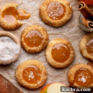 An array of caramel apple cider cookies on parchment paper.