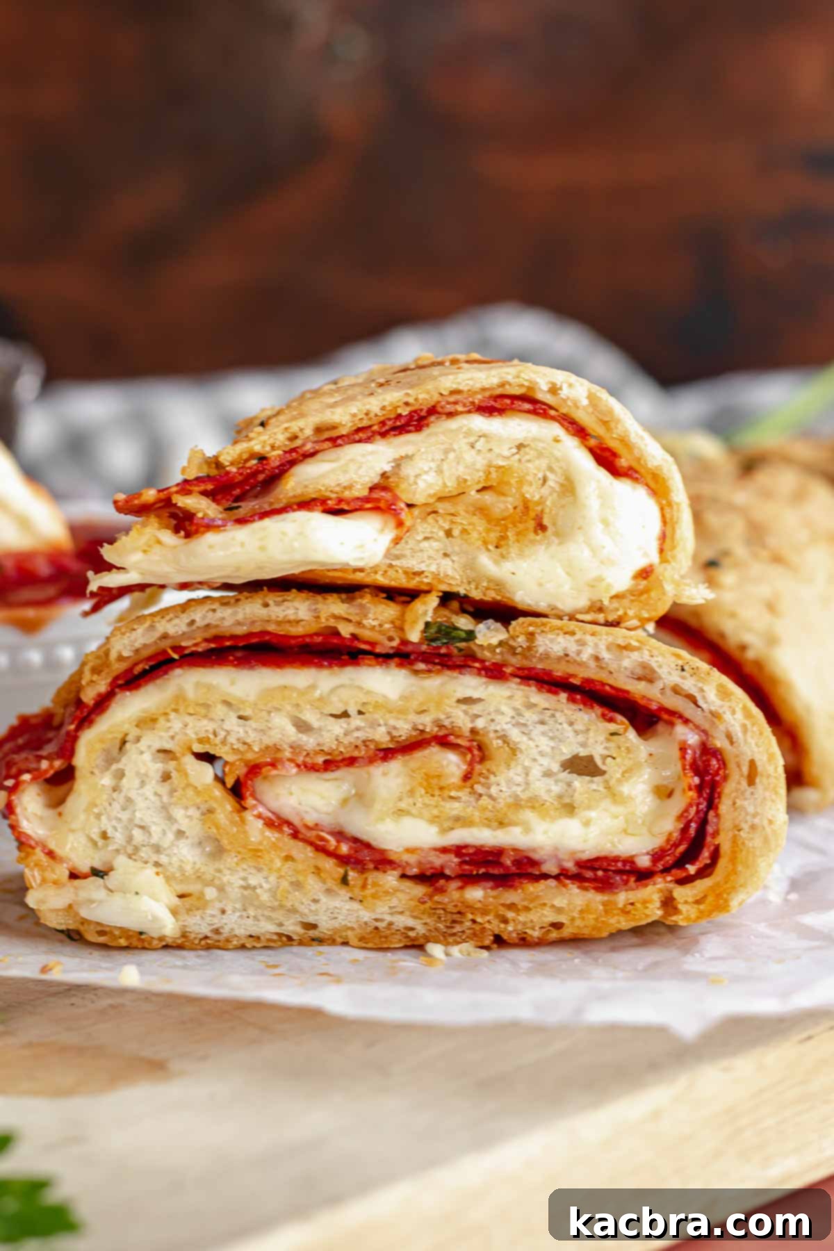 Two pieces of pepperoni bread on top of each other.