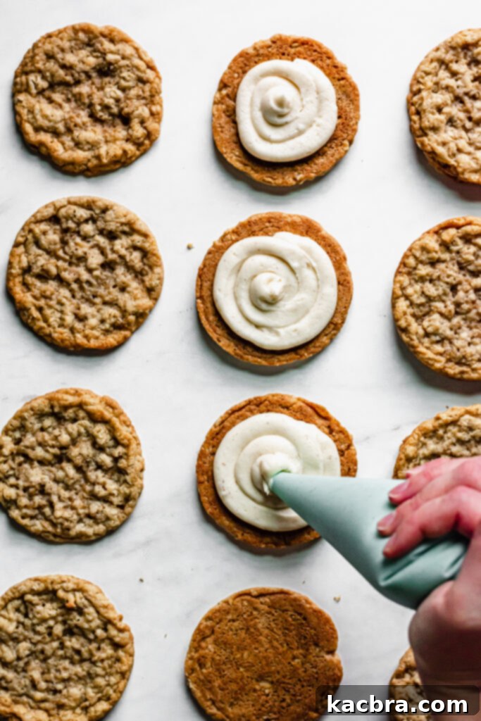 Piping eggnog frosting onto a cookie