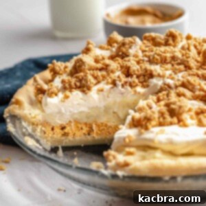 Amish peanut butter pie in a pie dish with a slice removed, showcasing its layers.