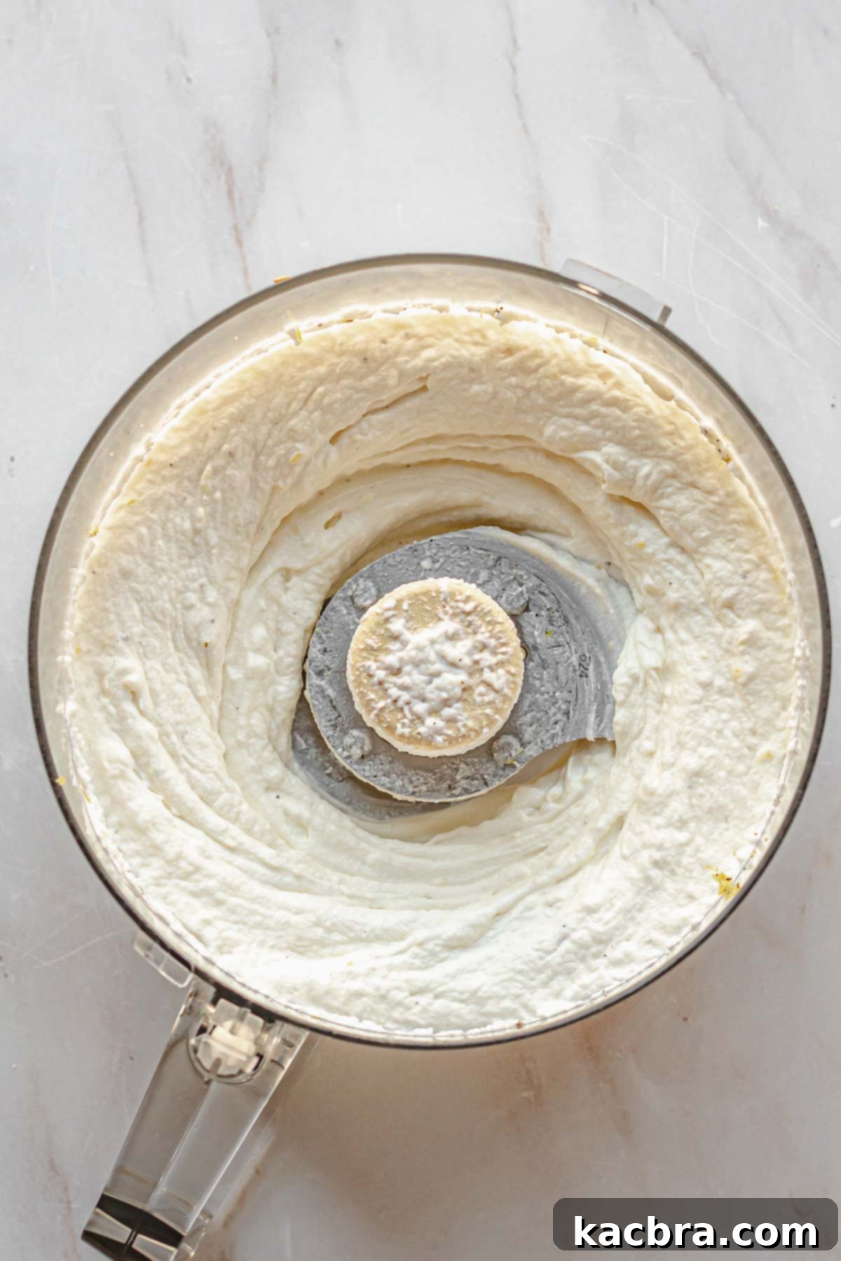 Fluffy Ricotta Crostini 8 Whipped ricotta cheese in a food processor bowl.