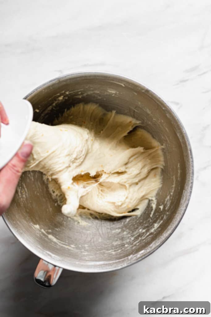 Image showing dough being kneaded in a stand mixer.