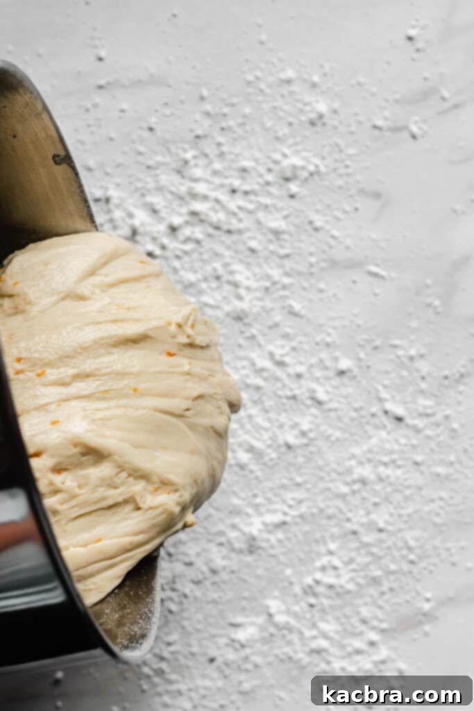 Image showing dough being kneaded on a floured surface.