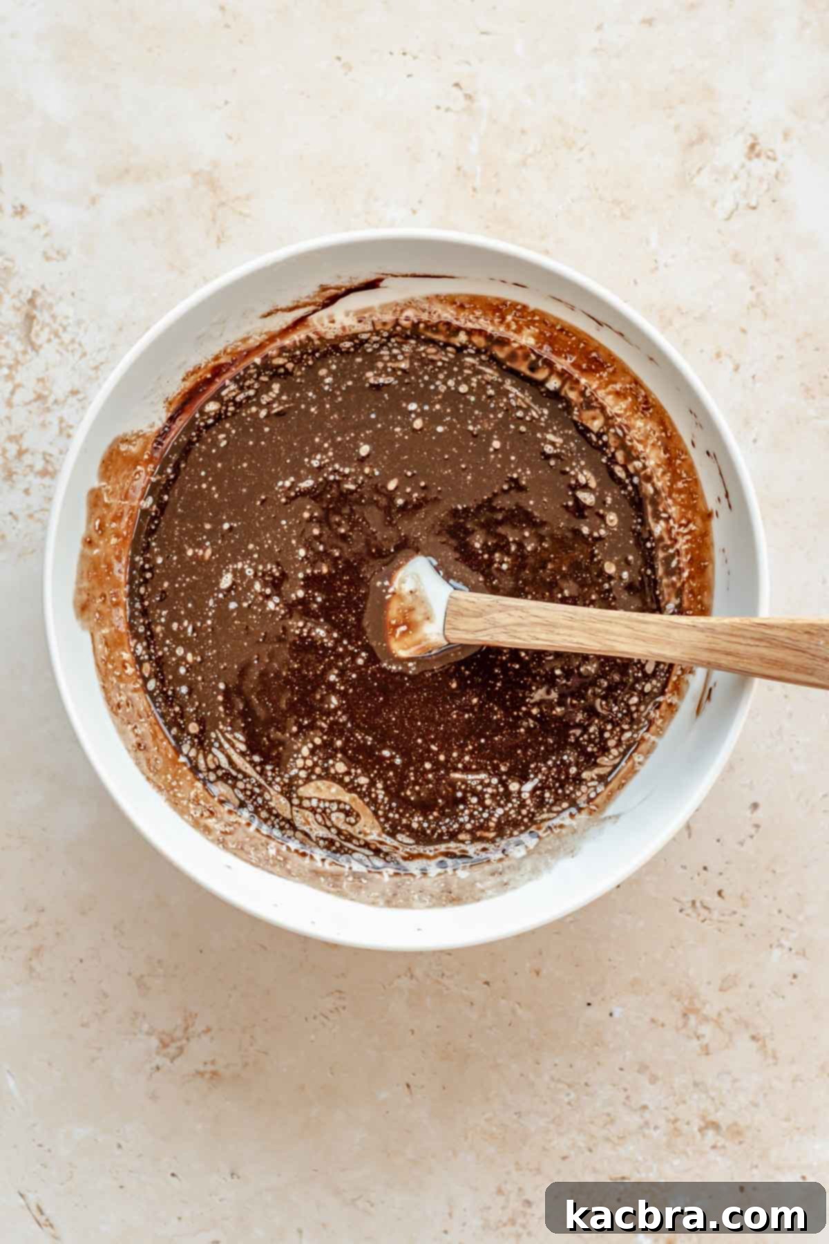 Chocolate and butter melted in a bowl, ready to be combined.