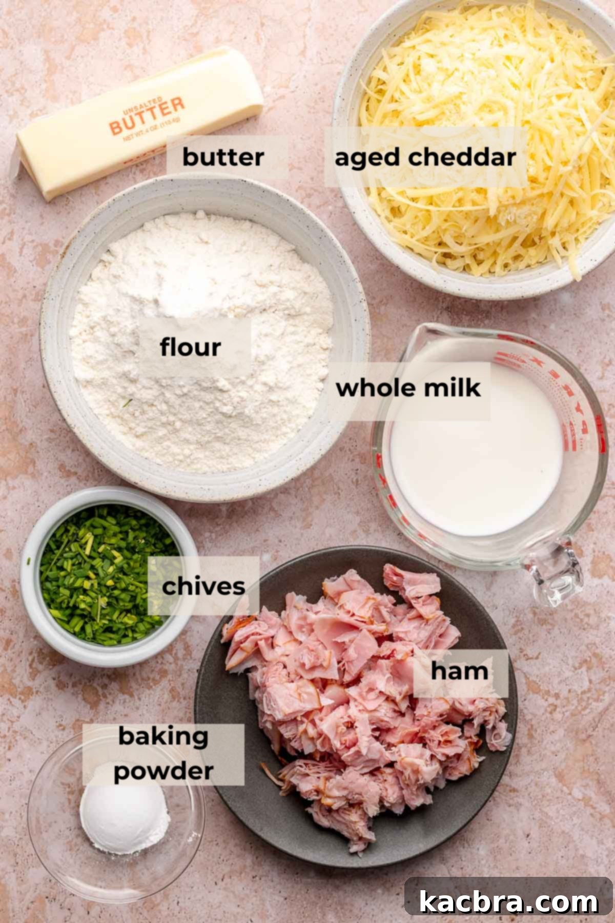 A beautifully arranged display of all the necessary ingredients for making delicious ham and cheese scones. The image highlights the fresh, high-quality components that contribute to the scones' exceptional taste and texture.