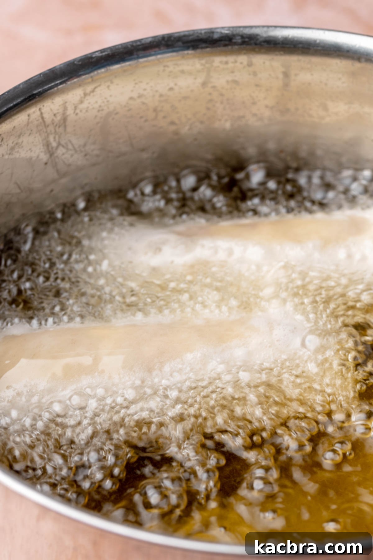 Reuben Spring Rolls 11 Egg rolls deep frying in bubbling oil