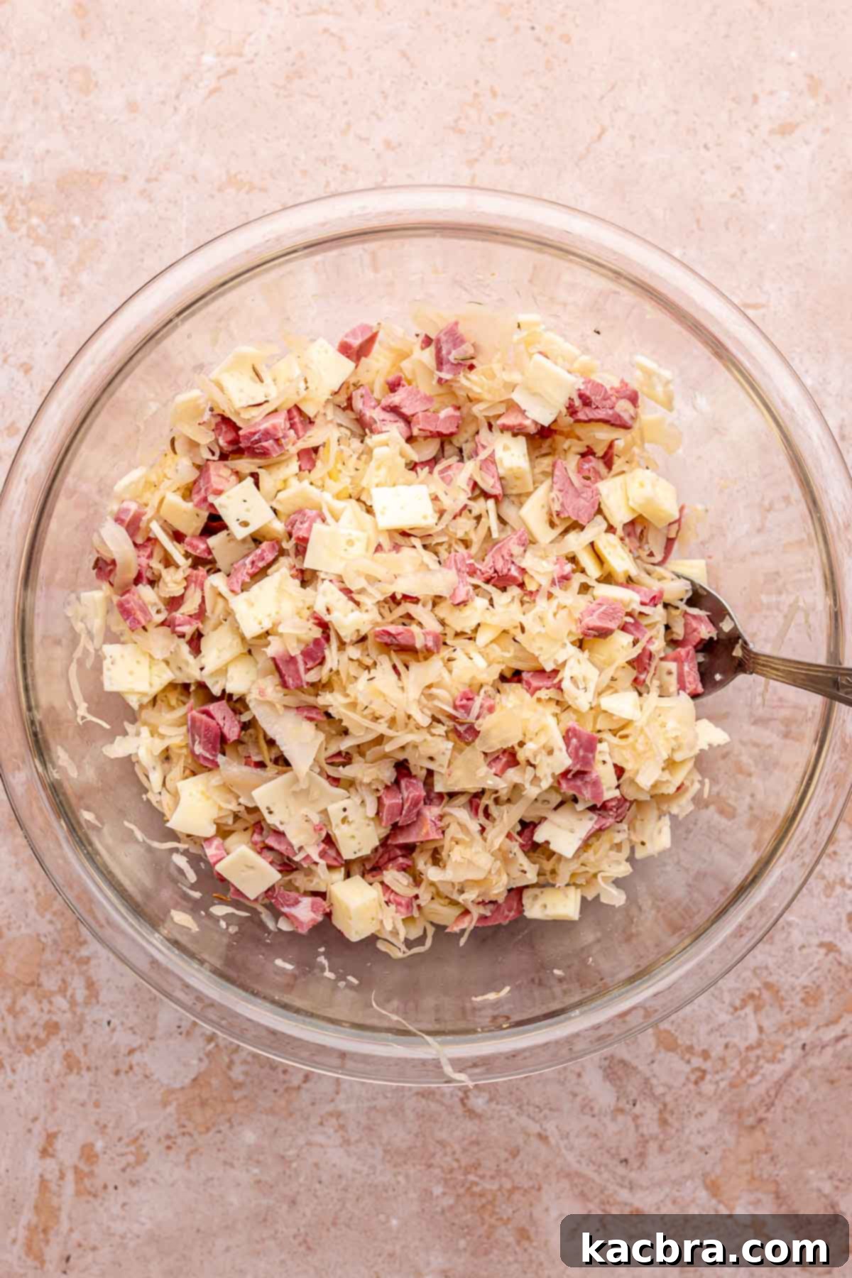 Reuben Spring Rolls 6 Egg roll filling ingredients mixed together in a bowl