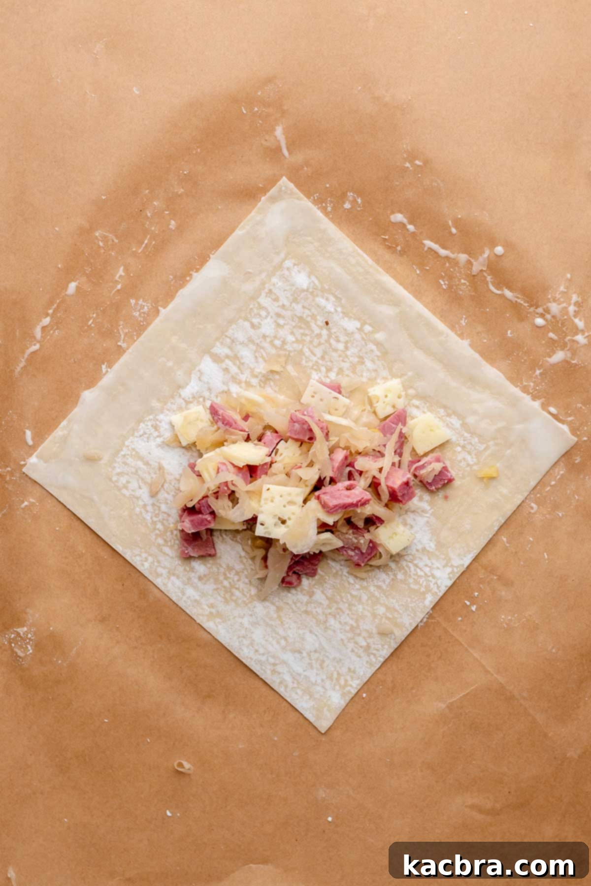 Reuben Spring Rolls 8 Egg roll filling in the center of an egg roll wrapper