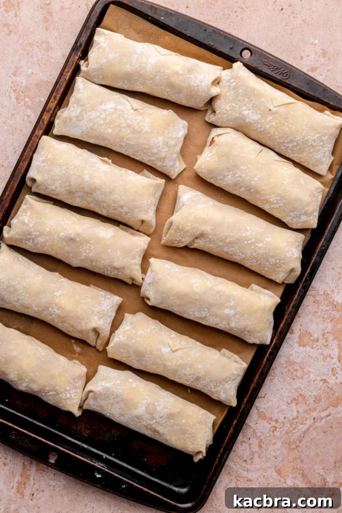Reuben Spring Rolls 10 Filled egg rolls on a sheet pan